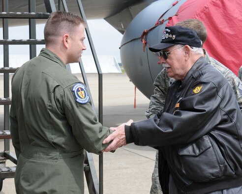 Joe Urice, right, a World War II veteran, greets U.S. Air Force Staff Sgt. Eric Sonnenberg, 351st Air Refueling Squadron training flight instructor and boom operator from Belen, N.M., during a base visit May 22, 2014, on RAF Mildenhall, England. Urice served from December 1944 to November 1945 with the 100th Bombardment Group as a B-17 Flying Fortress tail-gunner. (U.S. Air Force photo by Gina Randall/Released)