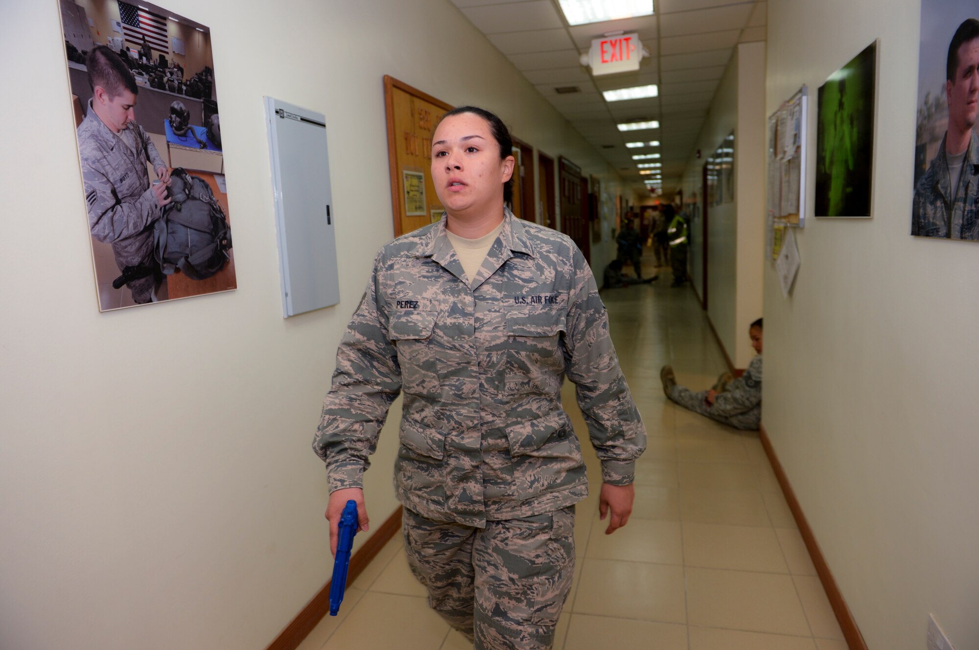 Staff Sgt. Lauren Perez, 386th Expeditionary Operational Support Squadron airfield management NCO, participates as an active shooter in the wing exercise May 23, 2014 at an undisclosed location in Southwest Asia. Members of the 386th Air Expeditionary Wing participated in a base exercise that included multiple scenarios to challenge and train Airmen on potential threats in a deployed environment. (U. S. Air Force photo by Staff Sgt. Jeremy Bowcock)
