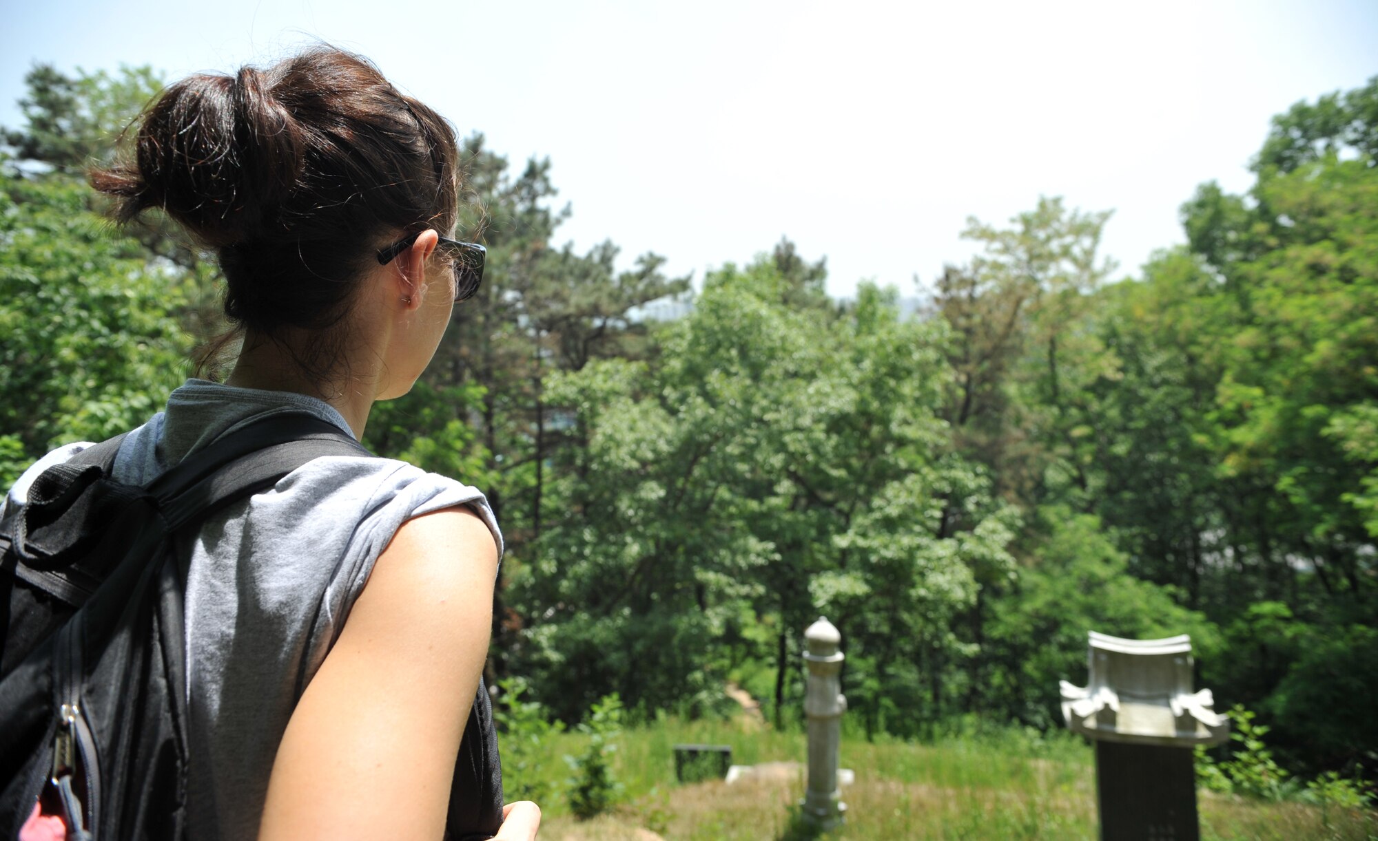 Senior Airman Traci Keller, 51st Fighter Wing Public Affairs Office radio and television broadcaster, takes in the view on her way up Buraksan Mountain during a resilience-building activity as part of Sexual Assault Prevention and Response Down Day in Pyeongtaek-si, Republic of Korea, May 22, 2014. Individual units were encouraged to participate in team activities after conducting group discussions about SAPR topics. (U.S. Air Force photo/Airman 1st Class Ashley J. Thum)