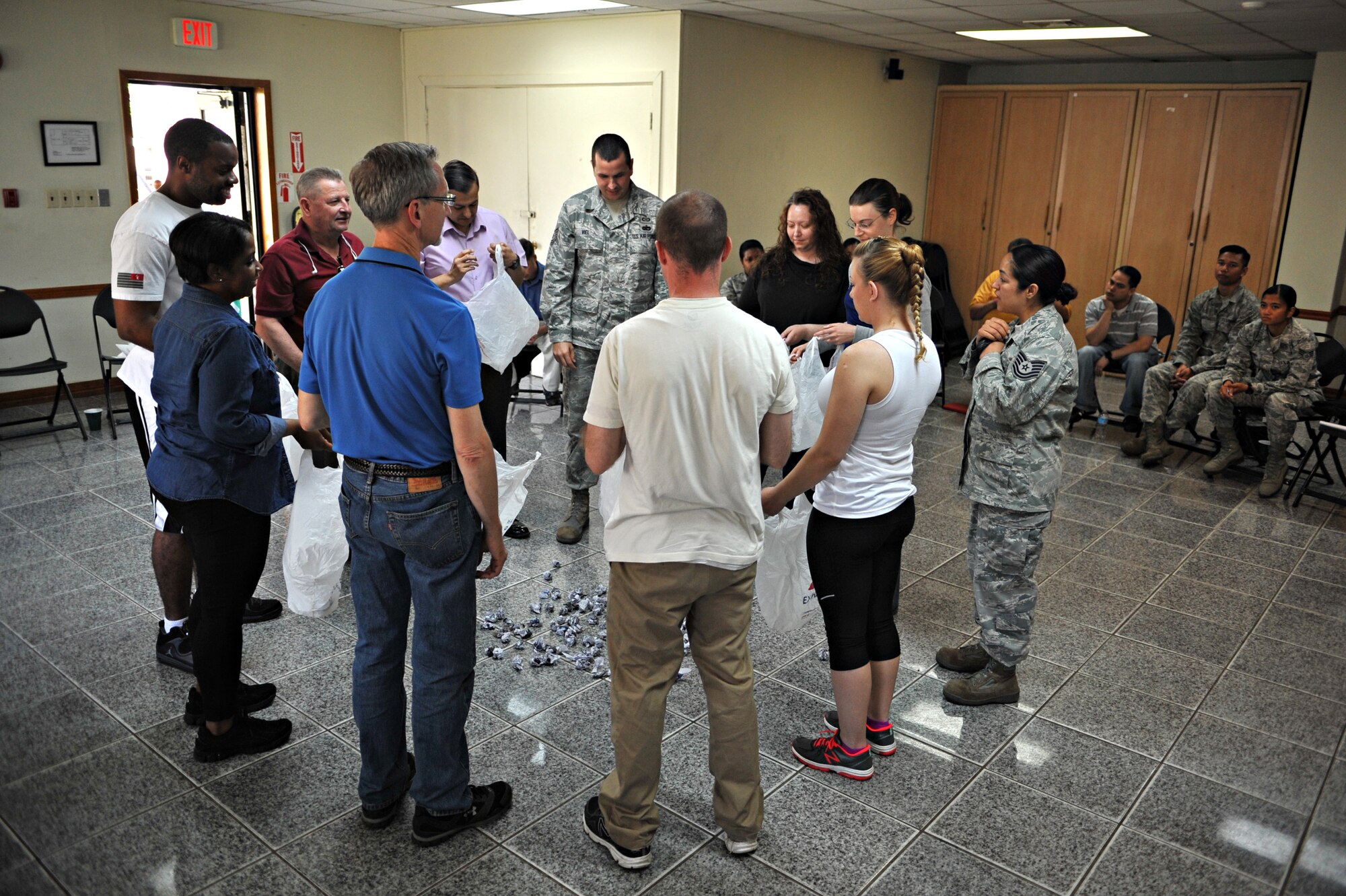 Tech. Sgt. Alejandra Chavez, 51st Fighter Wing Equal Opportunity Office NCO in charge and sexual assault prevention and response training facilitator, leads members of the 51st FW Staff Agencies in a training scenario during SAPR Down Day at Osan Air Base, Republic of Korea, May 22, 2014. The scenario illustrated the baggage sexual assault victims carry with them when they feel they have no support system, or do not use the one available to them. (U.S. Air Force photo/Airman 1st Class Ashley J. Thum)