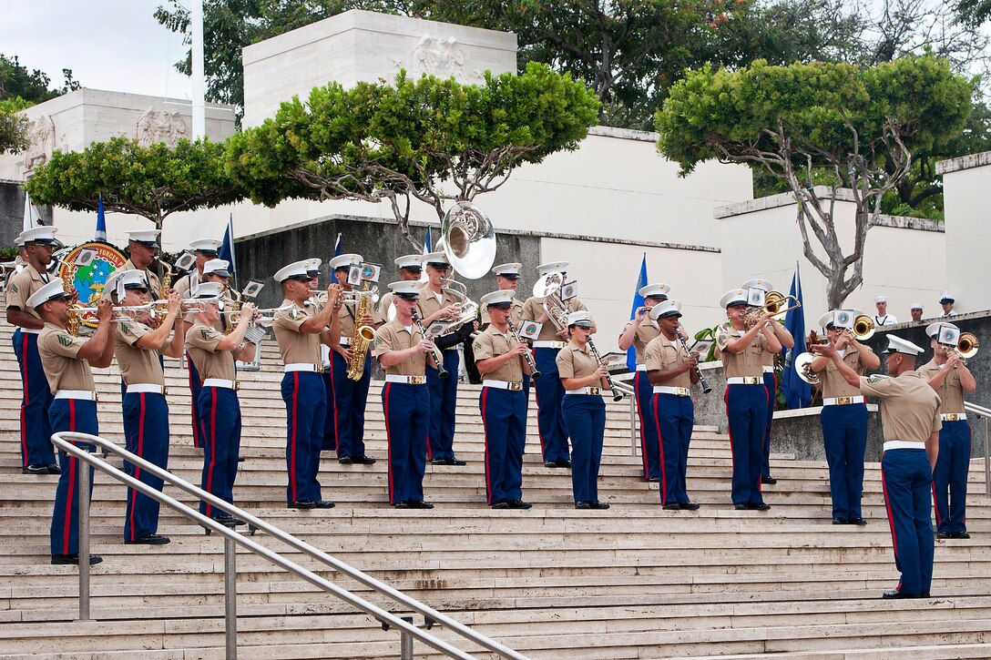 Members of the Marine Forces Pacific Band perform during a Memorial Day eve candlelight ceremony at the National Cemetery of the Pacific in Honolulu, May 25, 2014.