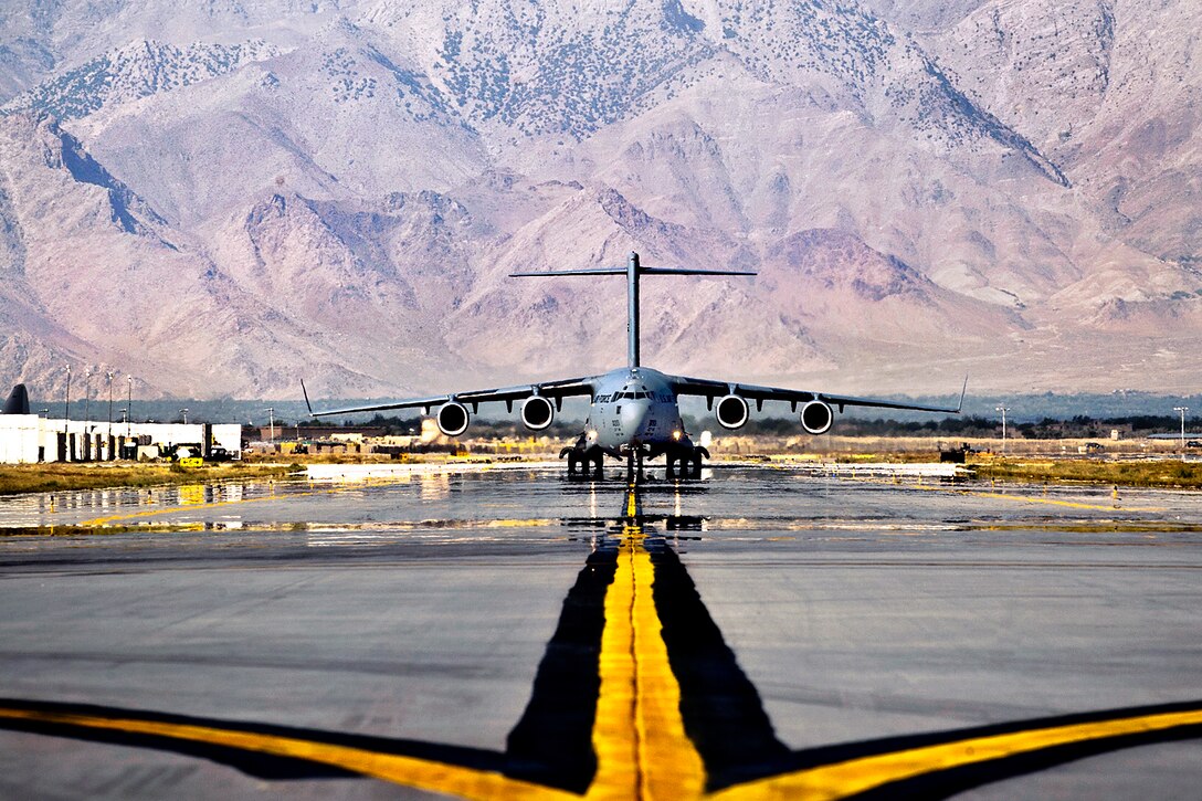 A U.S. Air Force C-17 Globemaster III aircraft taxis to its parking spot on Bagram Airfield, Afghanistan, Sept. 25, 2012. The Globemaster III is a regular visitor to Bagram Airfield, transporting troops, equipment and supplies in and out of the country.  
