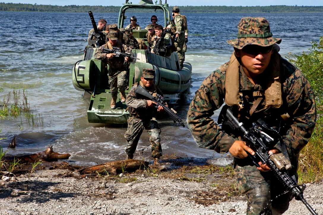 U.S. Marines and sailors insert into a landing zone as part of a scenario while conducting riverine training during UNITAS-Partnership of the Americas 2012 on Camp Blanding, Fla., Sept. 8, 2012. The event gives the participating troops from Brazil, Canada, Chile, Colombia, Ecuador, Mexico, Paraguay, Peru, the United States and Uruguay an opportunity to exercise critical thinking based on realistic scenarios, reinforce essential tactics and techniques.  
