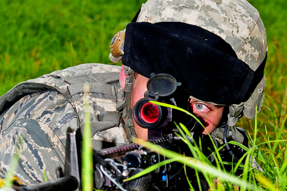 A U.S. Air Force airman keeps an eye out for role players portraying enemy fighters after he and his team members participated in a mock ambush during a route-clearance mission for an exercise in Thetford, England, Sept. 4, 2012. The airman is assigned to the 100th Security Forces Squadron, based at Royal Air Force Base Mildenhall, England.  
