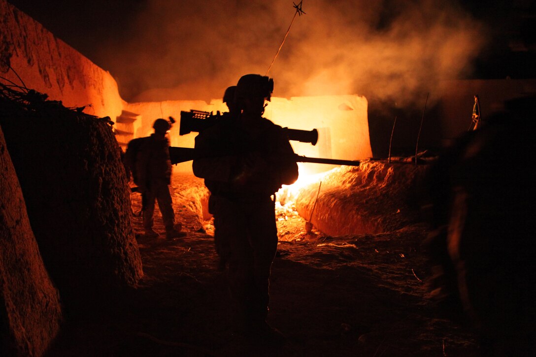 U.S. Marines exit a compound in Agha Ahmad in Afghanistan's Helmand province, Aug. 27, 2012. The Marines are assigned to Scout Sniper Platoon, Alpha Company, 1st Battalion, 1st Marines, Regimental Combat Team 6.  
