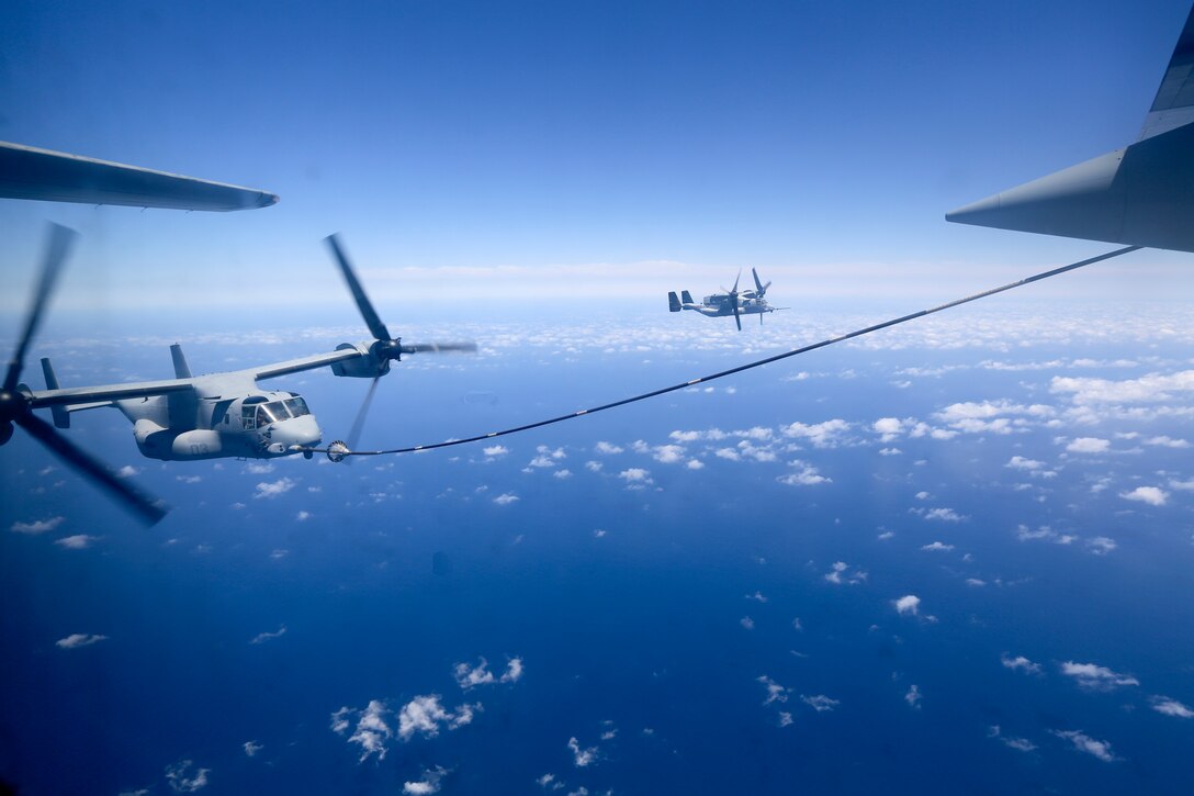 An MV-22B tiltrotor Osprey is refueled by a KC-130J off the coast of West Africa, May 05, 2014. The MV-22B's headed to Ghana as part of a two day training event with U.S. Marines of Special-Purpose Marine Air-Ground Task Force Crisis Response and the Ghanaian Air Force. The event allowed the Marines and the GAF to meet and promote cooperation and inter-operability between the two military forces. 