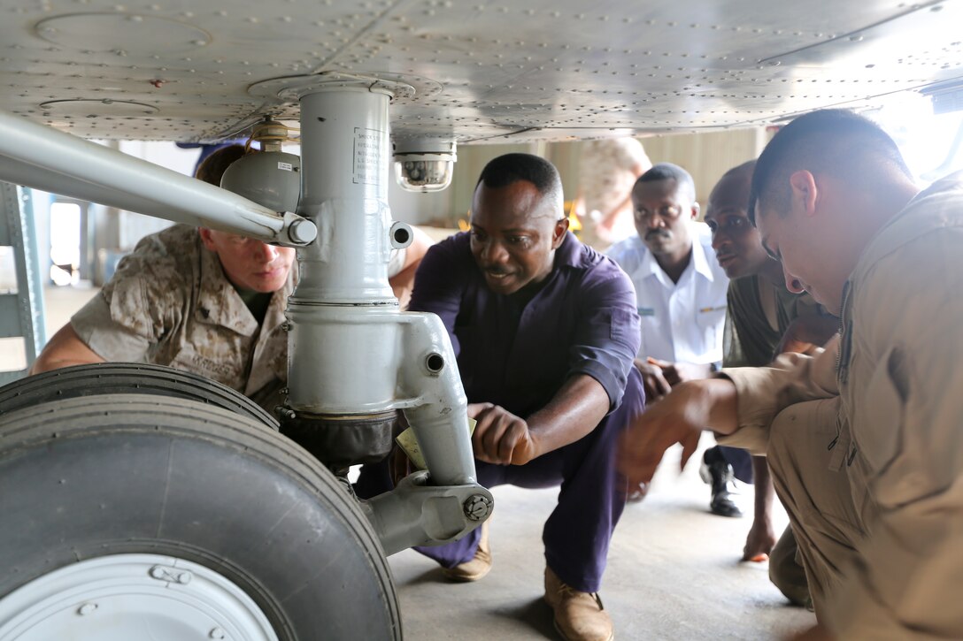 U.S. Marines of Special-Purpose Marine Air-Ground Task Force Crisis Response are shown intricacies and functions of the Mi-171Sh helicopter during a visit with the Ghanaian Air Force in Accra, Ghana, May 06, 2014. . The visit was held to increase partnership with Ghanaian Armed Forces.