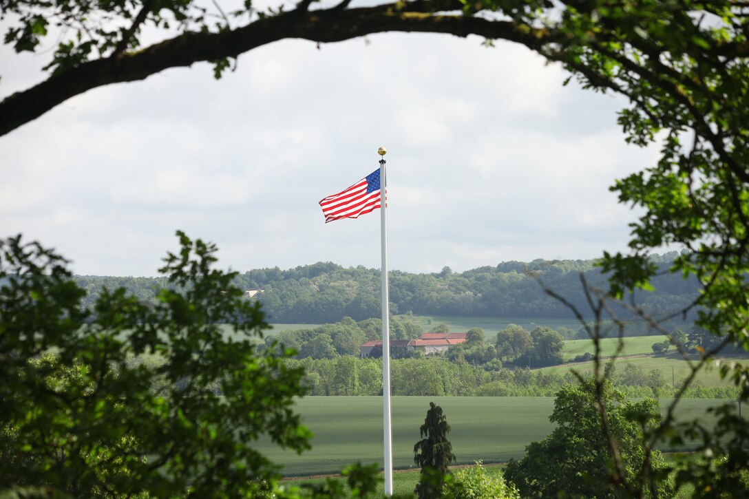 United States Marines and their French counterparts gathered at Aisne-Marne American Cemetery May 25 to celebrate Memorial Day, and to mark the 96th anniversary of the historic Battle of Belleau Wood. The event was held in the memorial cemetery which lies adjacent to the historic grounds of Belleau Wood and featured the laying of wreathes, a firing of volleys, the playing of "TAPS," raising of the American and French national colors, and a concert by the French and Marine Corps military bands. The mayor of the village of Bellau along with other military officers and officials representing the U.S. and France were present along with hundreds of locals and visitors from around the world. Participating units from the U.S. Marines included 5th Marine Regiment, the Wounded Warrior Regiment and Marine Forces Europe and Africa. French units that participated in the ceremony included the 21st Marine Infantry Regiment and the Musique Principale des Troupes de Marines.

