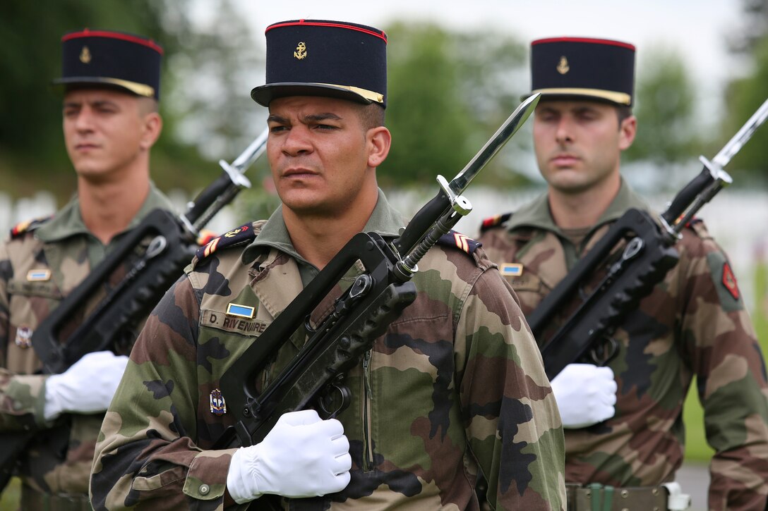 United States Marines and their French counterparts gathered at Aisne-Marne American Cemetery May 25 to celebrate Memorial Day, and to mark the 96th anniversary of the historic Battle of Belleau Wood. The event was held in the memorial cemetery which lies adjacent to the historic grounds of Belleau Wood and featured the laying of wreathes, a firing of volleys, the playing of "TAPS," raising of the American and French national colors, and a concert by the French and Marine Corps military bands. The mayor of the village of Bellau along with other military officers and officials representing the U.S. and France were present along with hundreds of locals and visitors from around the world. Participating units from the U.S. Marines included 5th Marine Regiment, the Wounded Warrior Regiment and Marine Forces Europe and Africa. French units that participated in the ceremony included the 21st Marine Infantry Regiment and the Musique Principale des Troupes de Marines.


