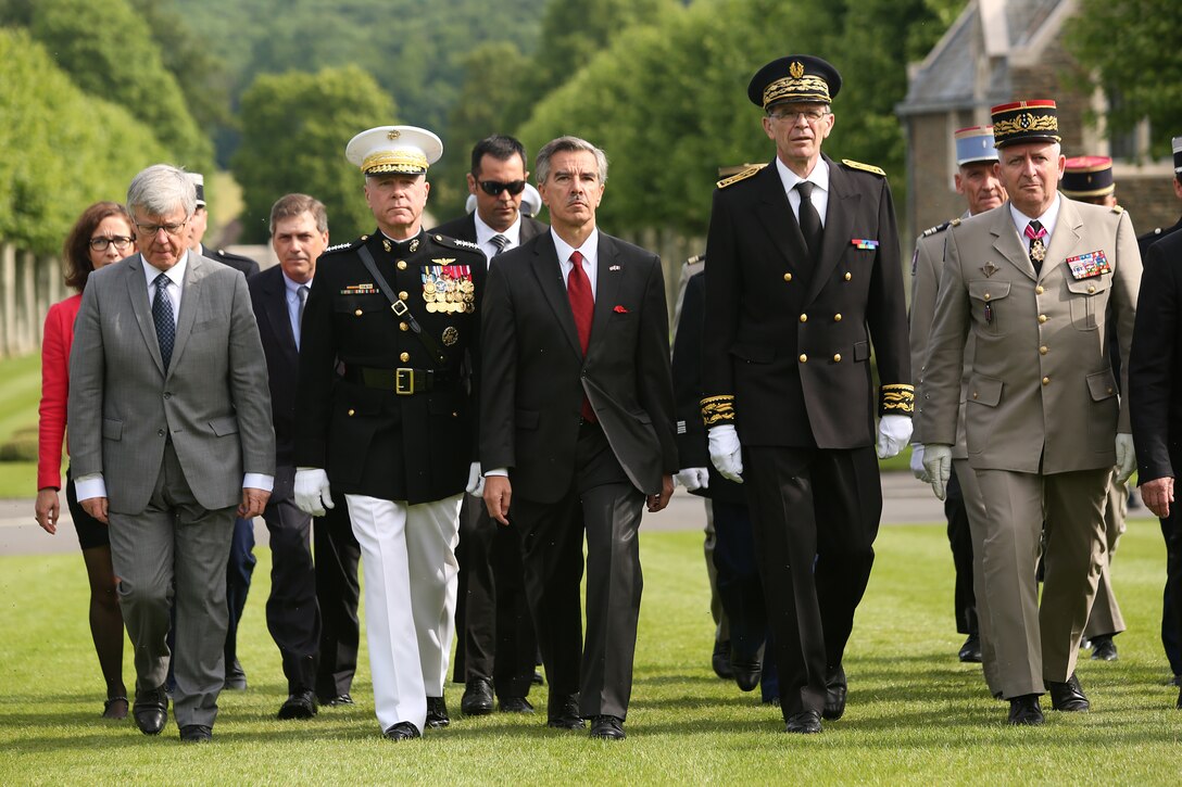 The Commandant of the Marine Corps, General James F. Amos and other American and French dignitaries make their official arrival into the parade grounds of the Aisne-Marne American Cemetery to begin the Belleau Wood Ceremony. United States Marines and their French counterparts gathered at cemetery May 25 to celebrate Memorial Day, and to mark the 96th anniversary of the historic Battle of Belleau Wood. The event was held in the memorial cemetery which lies adjacent to the historic grounds of Belleau Wood and featured the laying of wreathes, a firing of volleys, the playing of "TAPS," raising of the American and French national colors, and a concert by the French and Marine Corps military bands. The mayor of the village of Bellau along with other military officers and officials representing the U.S. and France were present along with hundreds of locals and visitors from around the world. Participating units from the U.S. Marines included 5th Marine Regiment, the Wounded Warrior Regiment and Marine Forces Europe and Africa. French units that participated in the ceremony included the 21st Marine Infantry Regiment and the Musique Principale des Troupes de Marines.

