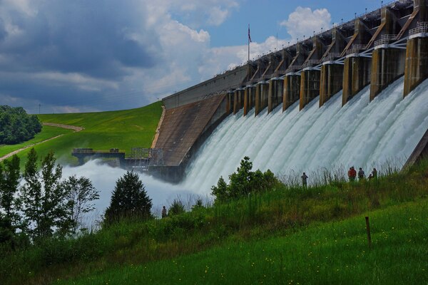 HARTWELL, Ga. - Water rushes through 12 spillway gates at the U.S. Army
Corps of Engineers' Hartwell Dam in the early morning hours of July 9, 2013.
The Corps activated the spillway gates to release excess water after heavy
rainfall the night before caused the reservoir to reach its maximum flood
storage capacity of 665 feet per mean sea level. During peak discharge, the
Corps released 74,000 cubic feet per second (cfs) of water through the
Hartwell Dam. This amount includes 32,000 cfs passing through the five
turbines (for hydropower generation) and 42,000 cfs passing through 12
spillway gates. Other than routine spillway gate tests, it was the first
time the spillway gates had been opened at the Hartwell Dam since Aug. 18,
1994. The only other occasion was on March 8, 1964. Photo by Doug Young.
