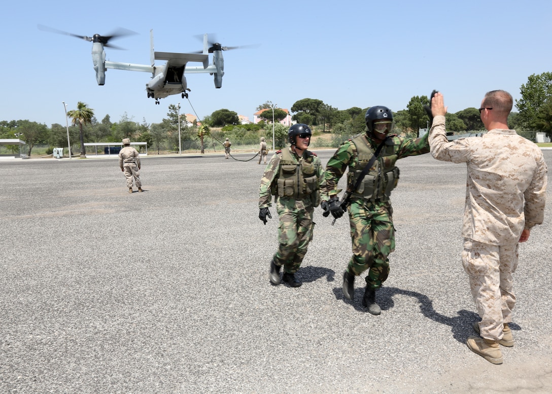 U.S. Marines of Special-Purpose Marine Air-Ground Task Force Crisis Response conduct helicopter rope suspension training during bilateral training with Portuguese Marines aboard Lisbon Naval Base, Portugal, May 15, 2014. The training allowed the Portuguese Marines to make use of the capabilities of the MV-22B Tiltrotor Osprey. 