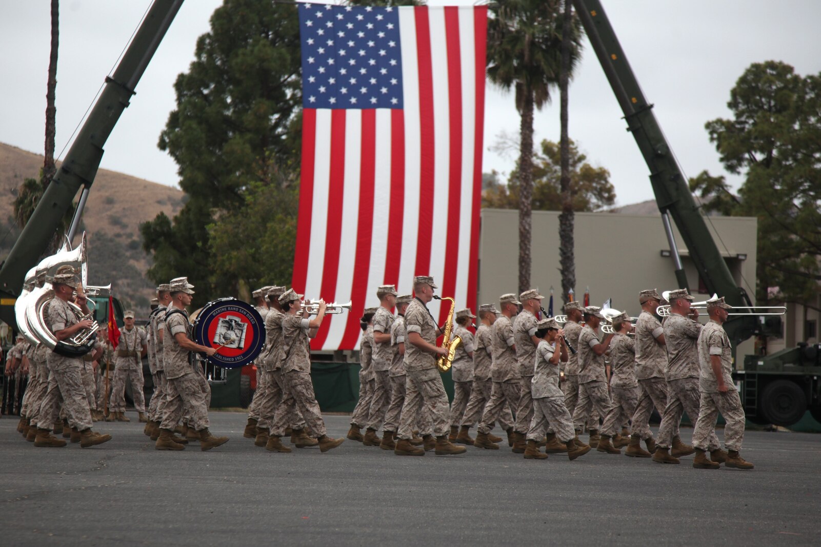 Marine Band San Diego marches across the parade deck during a change of command ceremony for Combat Logistics Regiment 15, 1st Marine Logistics Group, aboard Camp Pendleton, Calif., March 22, 2014.  Colonel Tracy King, commanding officer, Combat Logistics Regiment 15, 1st Marine Logistics Group, passed on the responsibility, authority and accountability of CLR-15 to Col. Seth Ocloo, who recently served as the assistant chief of staff for logistics at the 3rd Marine Aircraft Wing. (U.S. Marine Corps photo by Lance Cpl. Keenan Zelazoski)