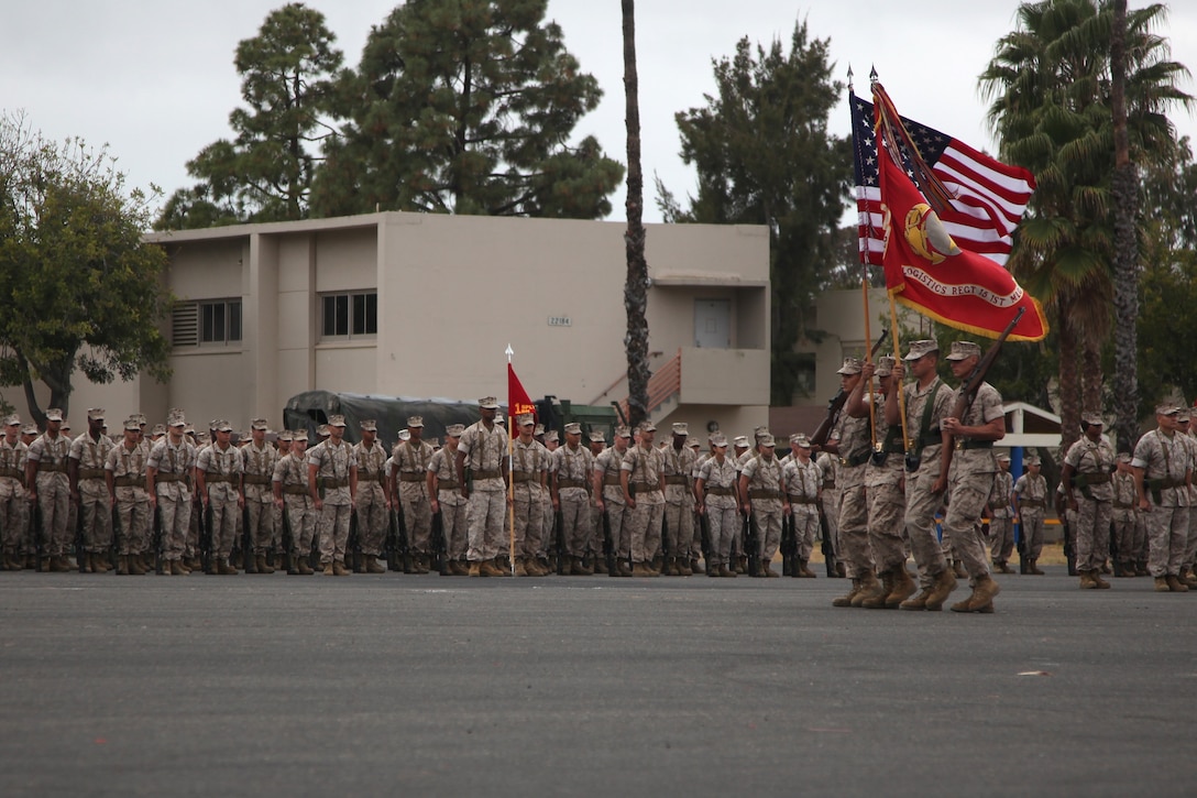 Marines with Combat Logistics Regiment 15, 1st Marine Logistics Group, march the colors onto the parade deck during their change of command ceremony aboard Camp Pendleton, Calif. May 22, 2014. Ocloo recently served as the assistant chief of staff for logistics at the 3rd Marine Aircraft Wing, received his new duty with enthusiasm. 