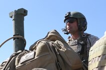 Sgt. Garrett Mellor, a gunner with Delta Company, 1st Light Armored Reconnaissance Battalion, scouts targets for a call for fire during Exercise Desert Scimitar aboard Marine Corps Air Ground Combat Center Twentynine Palms, Calif., May 13, 2014. Mellor, from Arlington, Texas, operates a M242 25mm cannon, an M240B machine gun and two 4-barrel smoke grenade launchers.