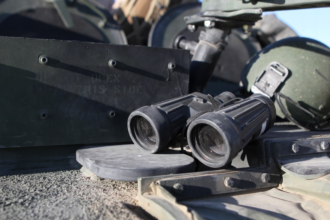 Binoculars are staged in preparation to be used for reconnaissance for live-fire training during Exercise Desert Scimitar aboard the Combat Center, Twentynine Palms, Calif., May 14, 2014. The binoculars are used by the vehicle commander to scout checkpoints, targets, and observe terrain features for enemy threats during convoys.