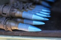 Tracer rounds are staged before being fired during Exercise Desert Scimitar, a combined-arms, live-fire exercise aboard Marine Corps Air Ground Combat Center, Twentynine Palms, Calif., May 14, 2014. Tracer rounds were used during fire drills to ensure that shots were impacting on targets. Other types of rounds include armor piercing, high explosive, and sabot.