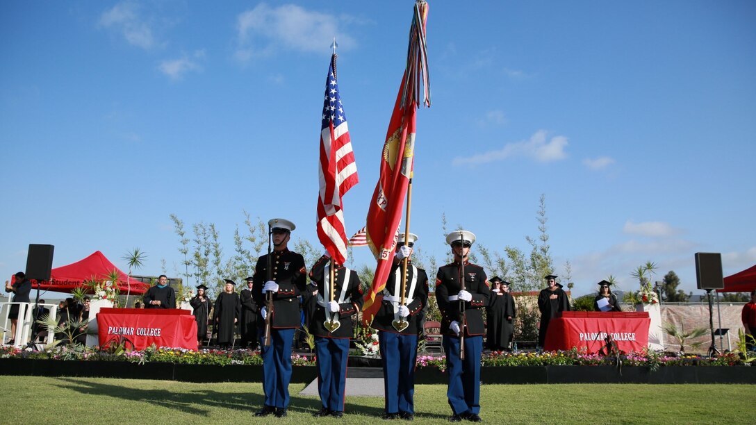 Sergeant Jamean Berry, center left, combat photographer, 15th Marine Expeditionary Unit, presents the colors during a commencement ceremony at Palomar College campus in San Marcos, Calif., May 20, 2014. Berry is from Colorado Springs, Colo. (U.S. Marine Corps photo by Lance Cpl. Anna Albrecht/Released)