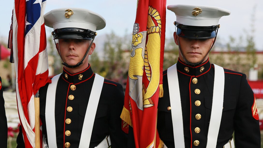 Sergeant Jamean Berry, left, combat photographer, 15th Marine Expeditionary Unit, prepares to present the colors during a commencement ceremony at Palomar College campus in San Marcos, Calif., May 20, 2014. Berry is from Colorado Springs, Colo. (U.S. Marine Corps photo by Lance Cpl. Anna Albrecht/Released)
