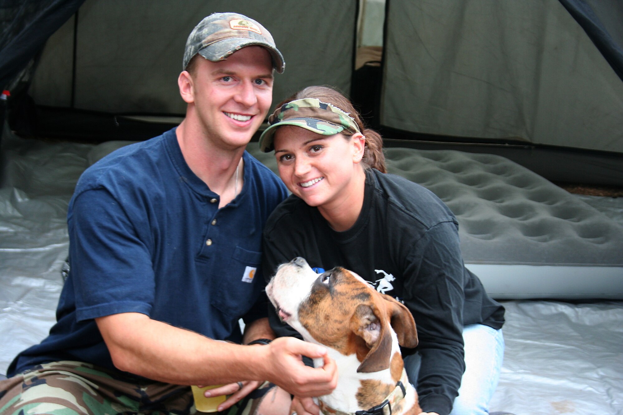 Captains David and Dana Lyon sit with their dog, Colt.  The 
Air Force named the service's newest pre-positioning vessel after Capt. David  Lyon, who died Dec. 27, 2013, in Kabul, Afghanistan, when a vehicle-born improvised explosive device was detonated near his convoy.  (Courtesy photo)
