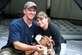Captains David and Dana Lyon sit with their dog, Colt.  The 
Air Force named the service's newest pre-positioning vessel after Capt. David  Lyon, who died Dec. 27, 2013, in Kabul, Afghanistan, when a vehicle-born improvised explosive device was detonated near his convoy.  (Courtesy photo)
