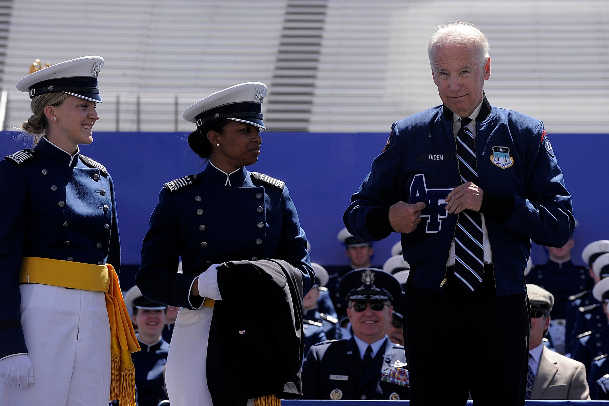 Vice President Joseph R. Biden receives an athletic jacket from the Air Force Academy's Class of 2014 during the Academy's graduation ceremony May 28, 2014, in Colorado Springs, Colo. Biden also delivered the commencement for the Academy's Class of 2009. (U.S. Air Force photo/Sarah Chambers)