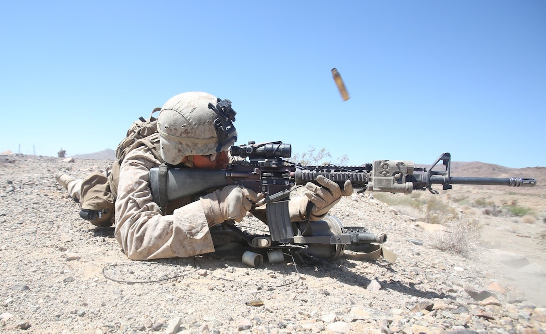 Lance Cpl. Andrew Hoffman, rifleman with Golf Company, 2nd Battalion, 4th Marine Regiment, fires at unknown distance targets during a live-fire range at Exercise Desert Scimitar aboard Marine Corps Air Ground Combat Center Twentynine Palms, Calif., May 12, 2014. Desert Scimitar is an annual combined-arms exercise to ensure I Marine Expeditionary Force is prepared to face any crisis worldwide.