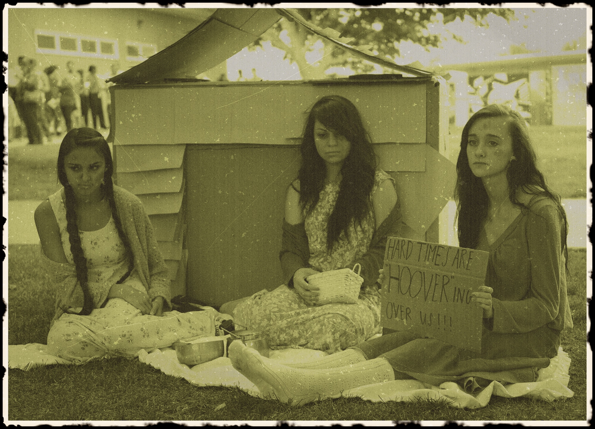 Graphically enhanced photo of Desert Junior-Senior High School students re-enacting a "Hooverville," which was a common term for homeless encampments throughout the Great Depression, during a "Night at the Museum" event hosted by the students and faculty of Desert Junior-Senior High School May 21, 2014. The second annual event was an end-of-year, school-wide project where students transformed the halls of the high school into static displays, living statues and interactive history exhibits. (U.S. Air Force graphic by Jet Fabara)
