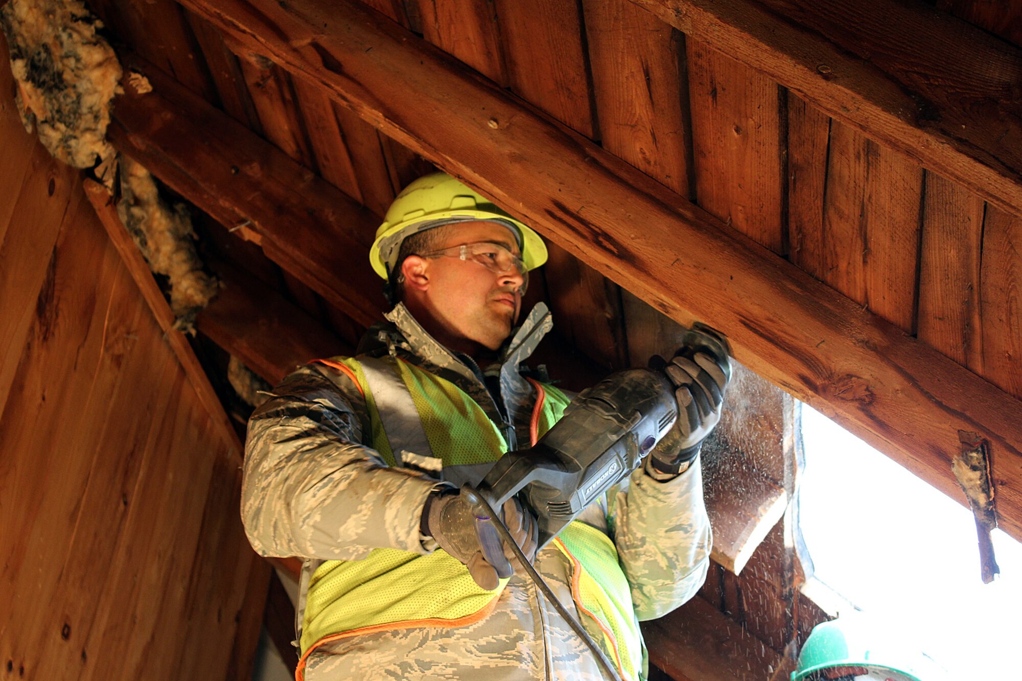 140528-Z-VA676-087  Staff Sgt. Richard Sanchez cuts out a piece of the roof of a building to prepare for an addition at Camp Hinds Boy Scout camp, Raymond, Maine, May 28, 2014. Sanchez, a member of the 127th Civil Engineer Squadron, Selfridge Air National Guard Base, Mich., is part of an Innovative Readiness Training mission at the camp, which allows military personnel to get training in various tasks and a community organization, in this case the Boy Scouts, to benefit from the work. Air National Guard, Marine and Army Reserve units from about a dozen different states will be working on a construction project at the camp during summer 2014. (U.S. Air National Guard photo by Technical Sgt. Dan Heaton)
