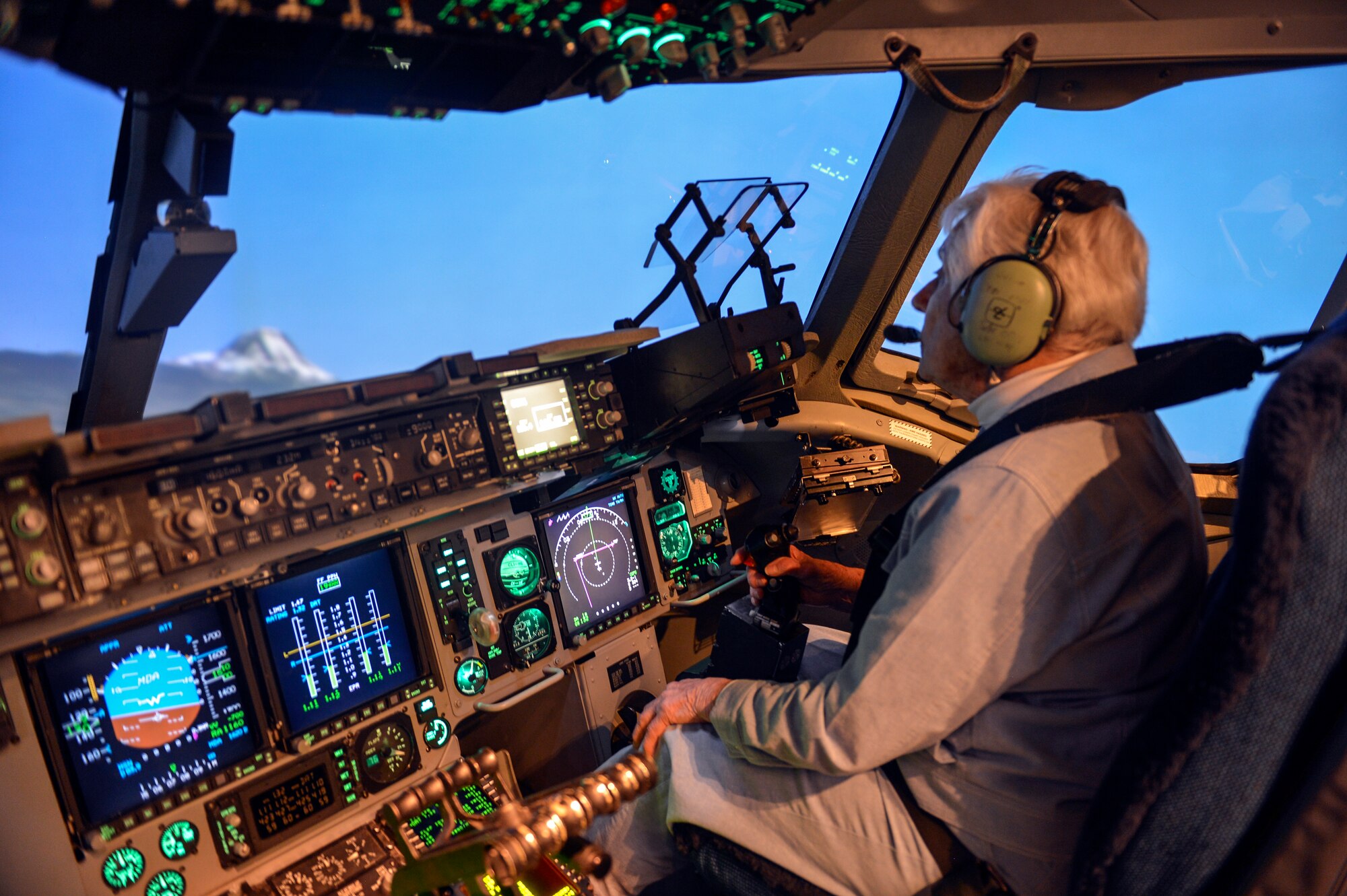 Betty Dybbro, Woman Airforce Service Pilots veteran, takes flight on a McChord Field C-17 Globemaster III simulator May 28, 2014, at Joint Base Lewis-McChord, Wash. Dybbro was given the opportunity to test her flying skills and did not disappoint as she took off, flew and landed the simulated aircraft with little difficulty. (U.S. Air Force photo/Staff Sgt. Russ Jackson)
