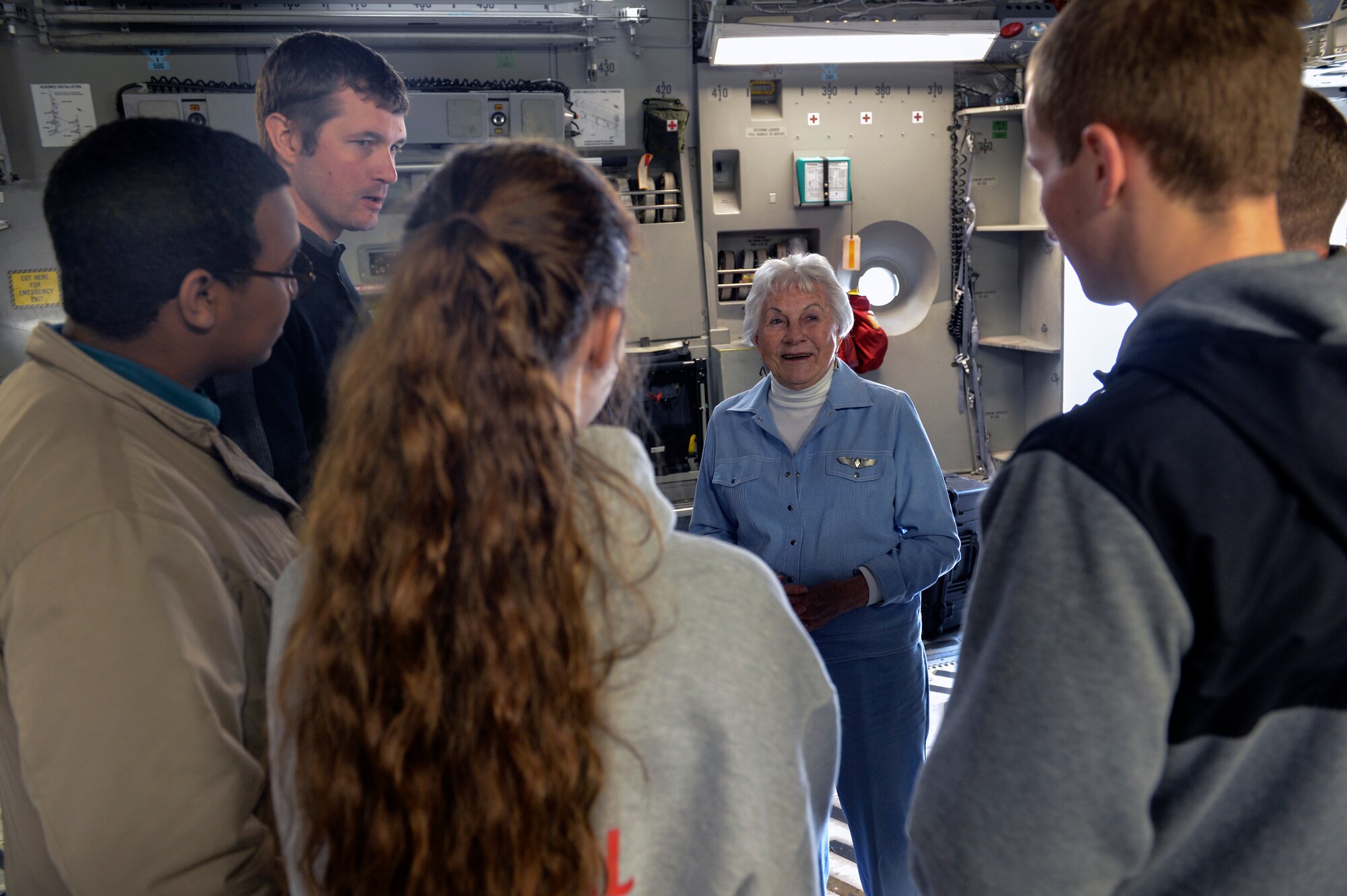 Students from a local Washington State high school with interests in aviation took advantage of conversing with Betty Dybbro, Woman Airforce Service Pilots veteran, during a tour of a C-17 Globemaster III aircraft May 28, 2014, at Joint Base Lewis-McChord, Wash. The students enjoyed the surprise of getting the opportunity to speak with a living piece of Air Force heritage when they discovered Dybbro was aboard the aircraft. (U.S. Air Force photo/Staff Sgt. Russ Jackson)