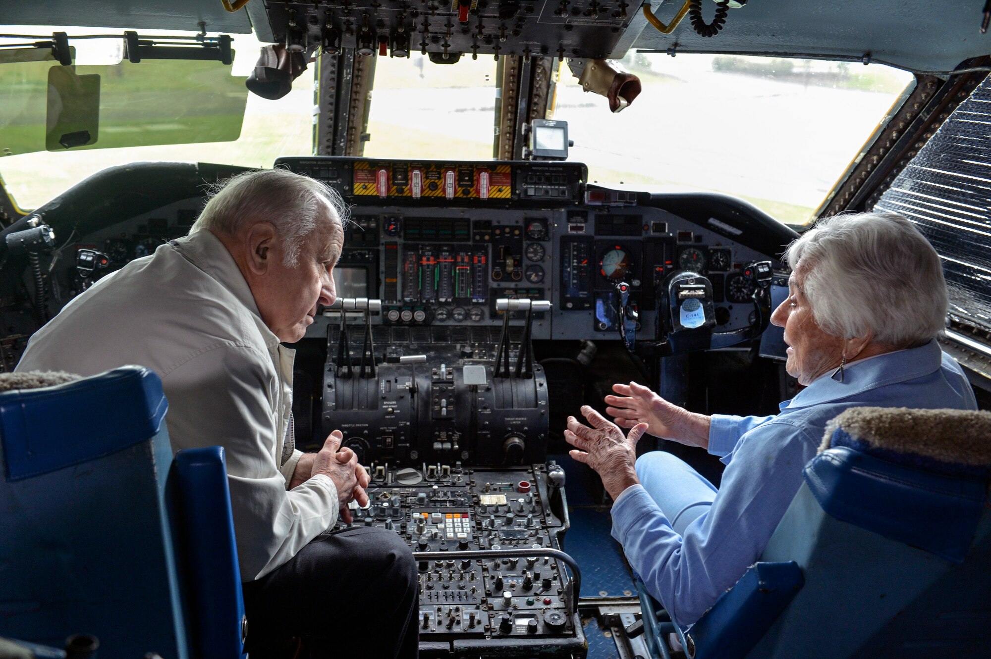Betty Dybbro, Woman Airforce Service Pilots veteran, tells retired Maj. Gen. Don Brown of her flying experiences as a WASP while sitting in the cockpit of the Lockheed-Georgia C-141B Starlifter at Heritage Hill May 28, 2014, at Joint Base Lewis-McChord, Wash. Of the 25,000 women who applied to be a WASP, Dybbro was one of 1,074 who earned her wings. (U.S. Air Force photo/Staff Sgt. Russ Jackson)