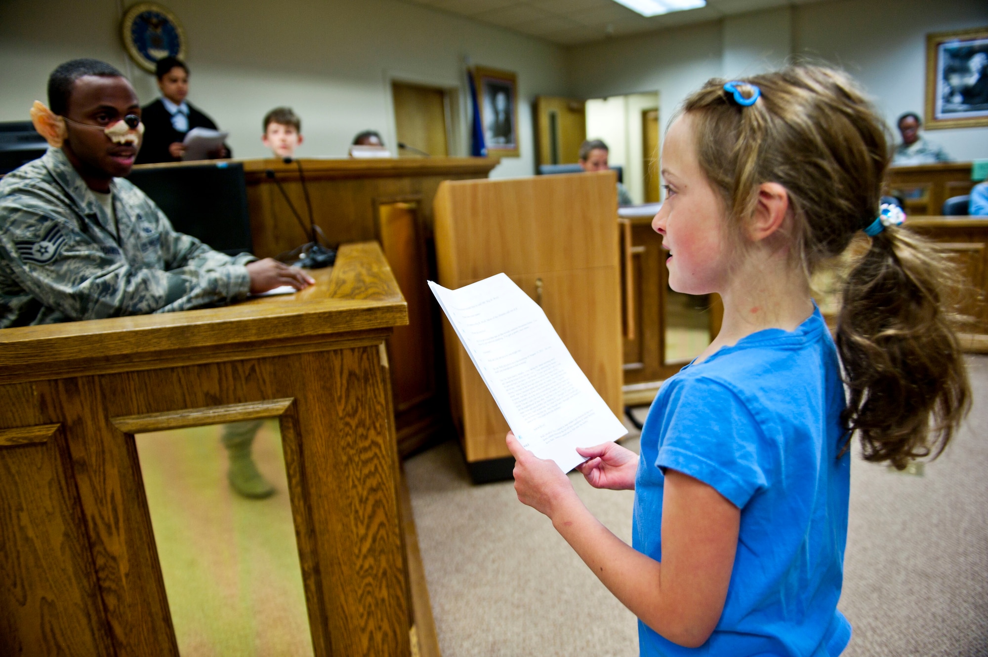Mr. Wolf answers questions for the jury during a mock trial during Law Day May 28, 2014, at Mountain Home Air Force Base, Idaho. The mock trial was a tool used to teach the children different aspects of law and what each member of the legal team does. (U.S. Air Force photo by Airman 1st Class Malissa Lott/RELEASED)