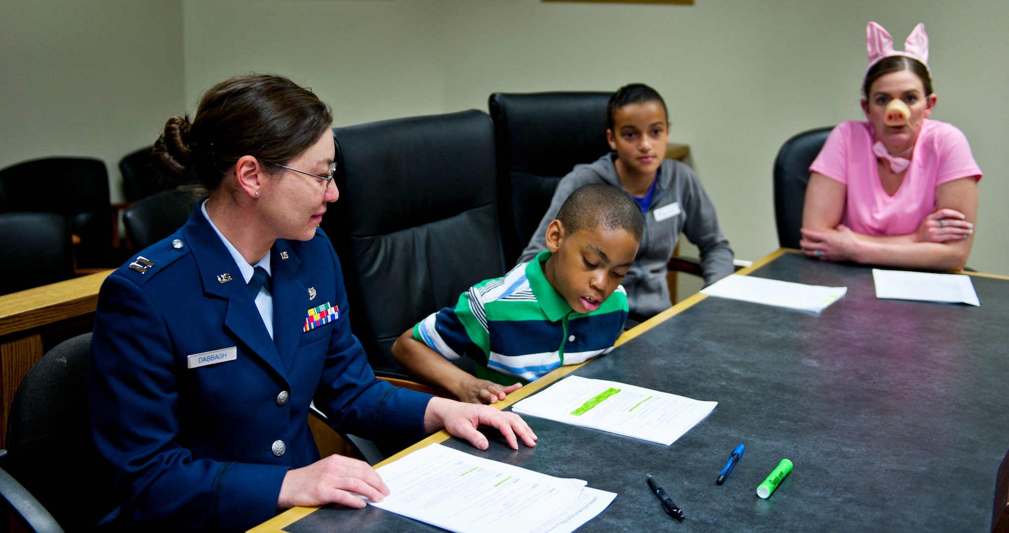The defense team presents their case before the court during a mock trial for Law Day May 28, 2014, at Mountain Home Air Force Base, Idaho. Children participating in Law Day were assigned as lawyers, jury members, bailiff or judges and each had an important role to play during the mock trial. (U.S. Air Force photo by Airman 1st Class Malissa Lott/RELEASED)