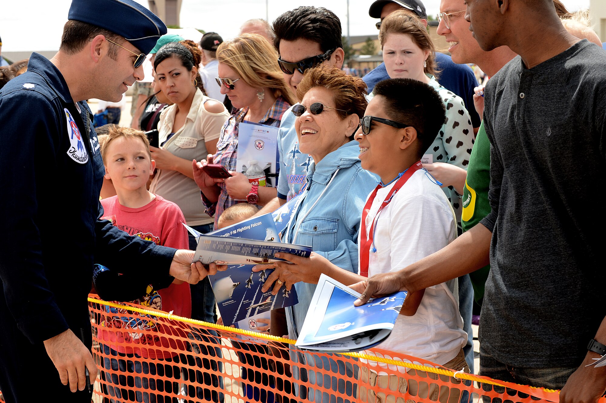 U.S. Air Force Lt. Col. Gregory Moseley, U.S. Air Force Air Demonstration Squadron "Thunderbirds" commander, meets and greets with fans during the air show and open house May 24, 2014 at Cannon Air Force Base, N.M. Thousands travelled from the local area and bordering states to witness aerial demonstrations, view static displays and listen to musical performances at Cannon’s Air Show and Open House. (U.S. Air Force photo/ Staff Sgt. Matthew Plew)