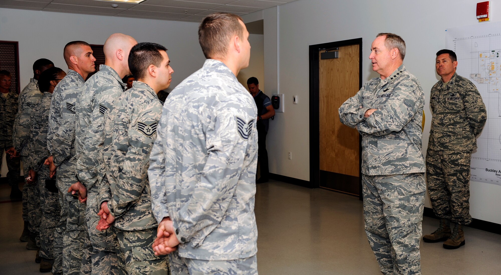 Air Force Chief of Staff Gen. Mark A. Welsh III talks with 460th Security Forces Squadron members during a visit May 27, 2014, to Buckley Air Force Base, Colo. Welsh’s trip to Buckley included mission briefings, Airmen recognition and a chance for the base to meet the Air Force’s top officer. (U.S. Air Force photo by Airman 1st Class Samantha Saulsbury/Released)
