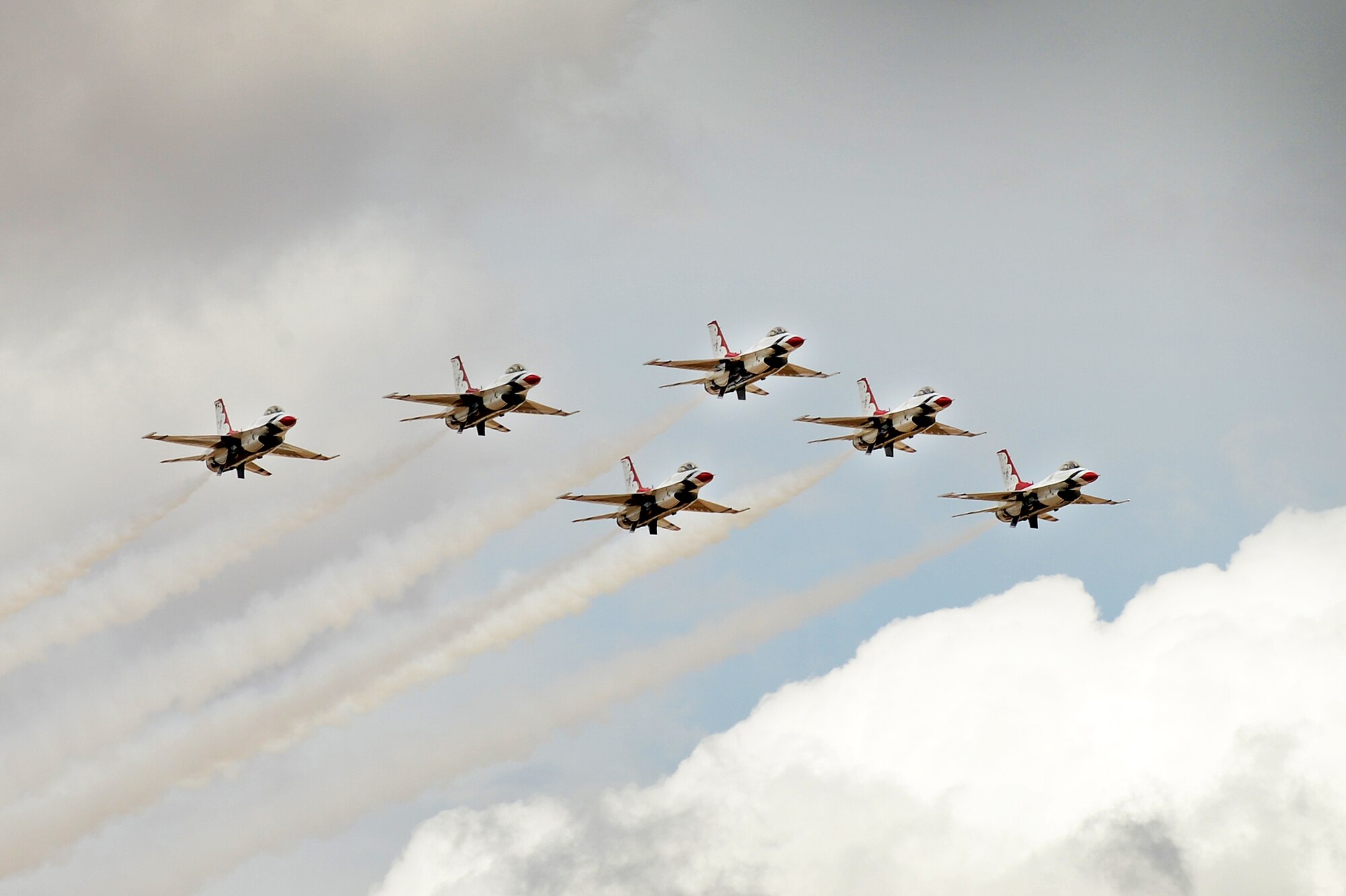 U.S. Air Force Thunderbirds fly in formation during the air show and open house May 24, 2014 at Cannon Air Force Base, N.M. Thousands travelled from the local area and bordering states to witness aerial demonstrations, view static displays and listen to musical performances at Cannon’s Air Show and Open House. (U.S. Air Force photo/ Staff Sgt. Matthew Plew)