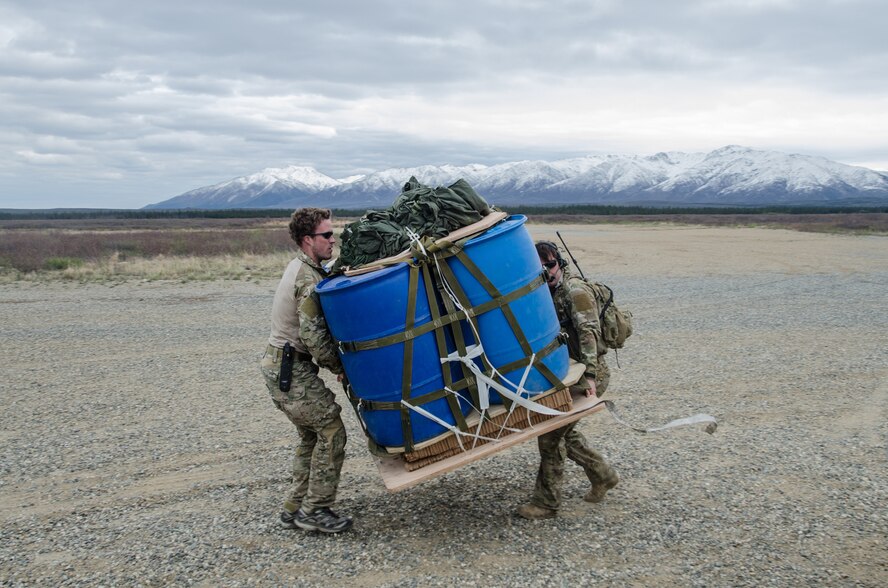 Tech. Sgt. Jeff Kinlaw (left) and Master Sgt. Harley Bobay, combat controllers from the Kentucky Air National Guard’s 123rd Special Tactics Squadron, prepare a container delivery system bundle for loading onto a Kentucky Air National Guard C-130 Hercules at the Donnelly drop zone in the Pacific-Alaska Range Complex as part of Red Flag-Alaska on May 21, 2014. More than 100 Kentucky Airmen participated in the exercise from May 7 to 23. (U.S. Air National Guard photo by Master Sgt. Phil Speck)