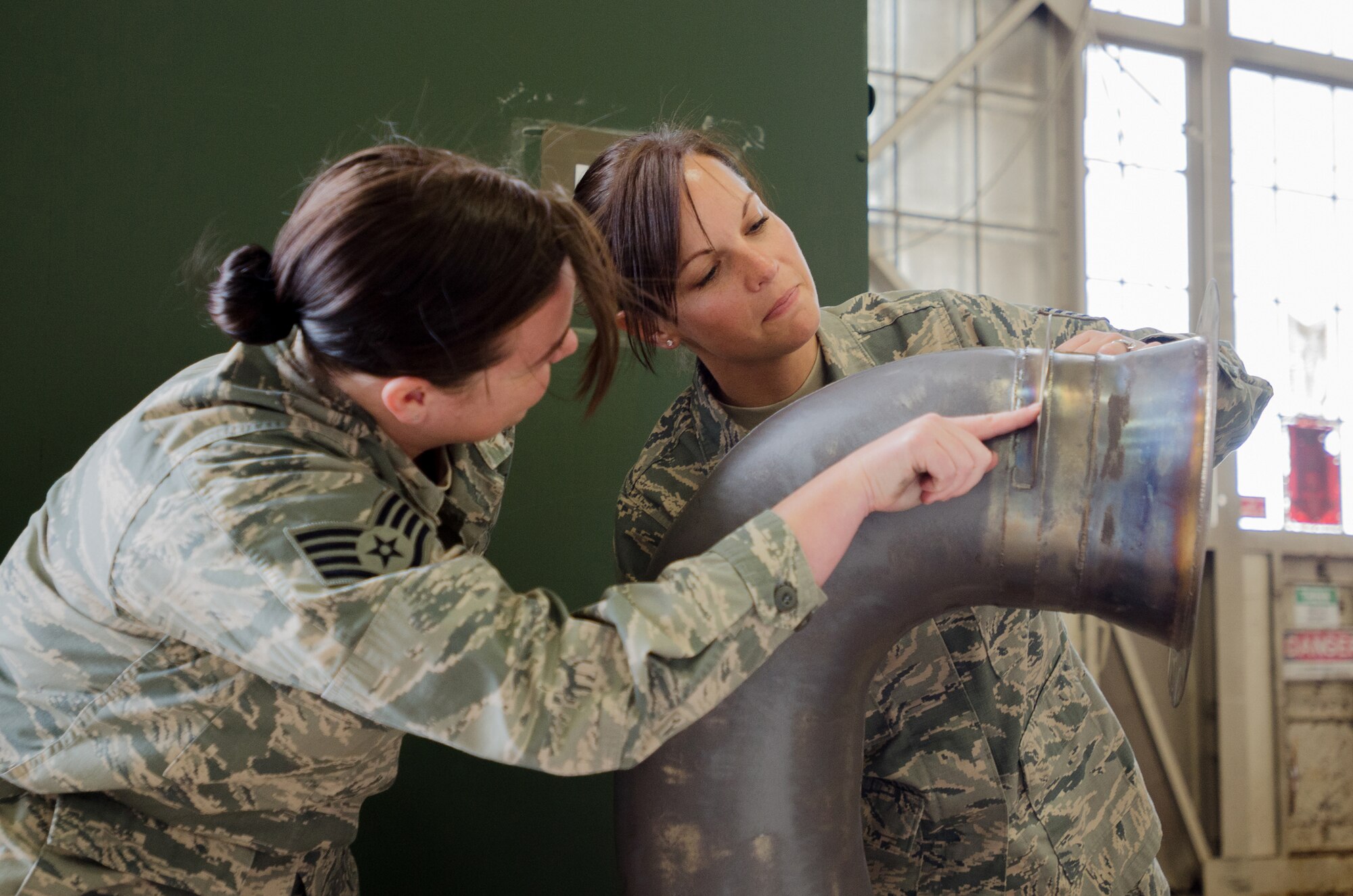 Tech. Sgt. Tracy Cordy (right), chief of supply for the Kentucky Air National Guard’s deployed forces during exercise Red Flag-Alaska, and Staff Sgt. April Kennedy, Red Flag-Alaska supply liaison, inspect an item for turn-in at Joint Base Elmendorf-Richardson, Alaska, on May 19, 2014. More than 100 Kentucky Airmen participated in the exercise from May 7 to 23. (U.S. Air National Guard photo by Master Sgt. Phil Speck)