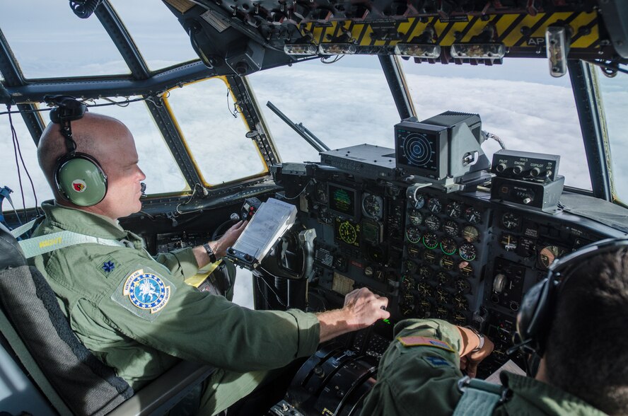 Lt. Col. Dave Flynn, a pilot for the Kentucky Air National Guard’s 165th Airlift Squadron, flies a Kentucky Air Guard C-130 Hercules in the skies of Alaska during a training scenario as part of Red Flag-Alaska on May 13, 2014. More than 100 Kentucky Airmen participated in the exercise from May 7 to 23. (U.S. Air National Guard photo by Master Sgt. Phil Speck)