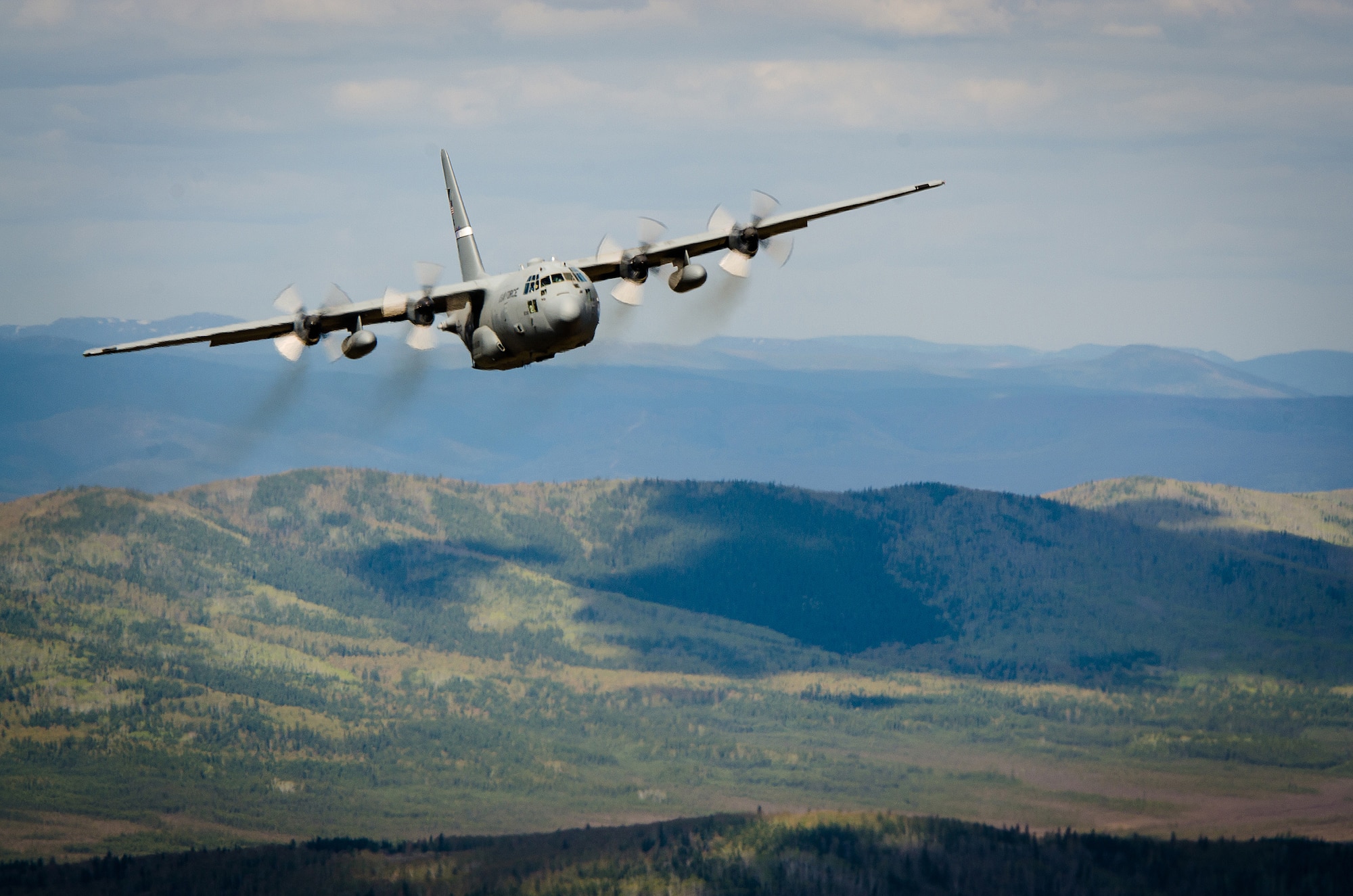 A Kentucky Air National Guard C-130 flies over Alaska on May 9, 2014, in support of Exercise Red Flag-Alaska. More than 100 Kentucky Airmen from the 123rd Airlift Wing participated in the exercise from May 7 to May 23. Red Flag-Alaska is designed to hone the combat skills of U.S. Air Force flight crews. (U.S. Air National Guard photo by Master Sgt. Phil Speck)