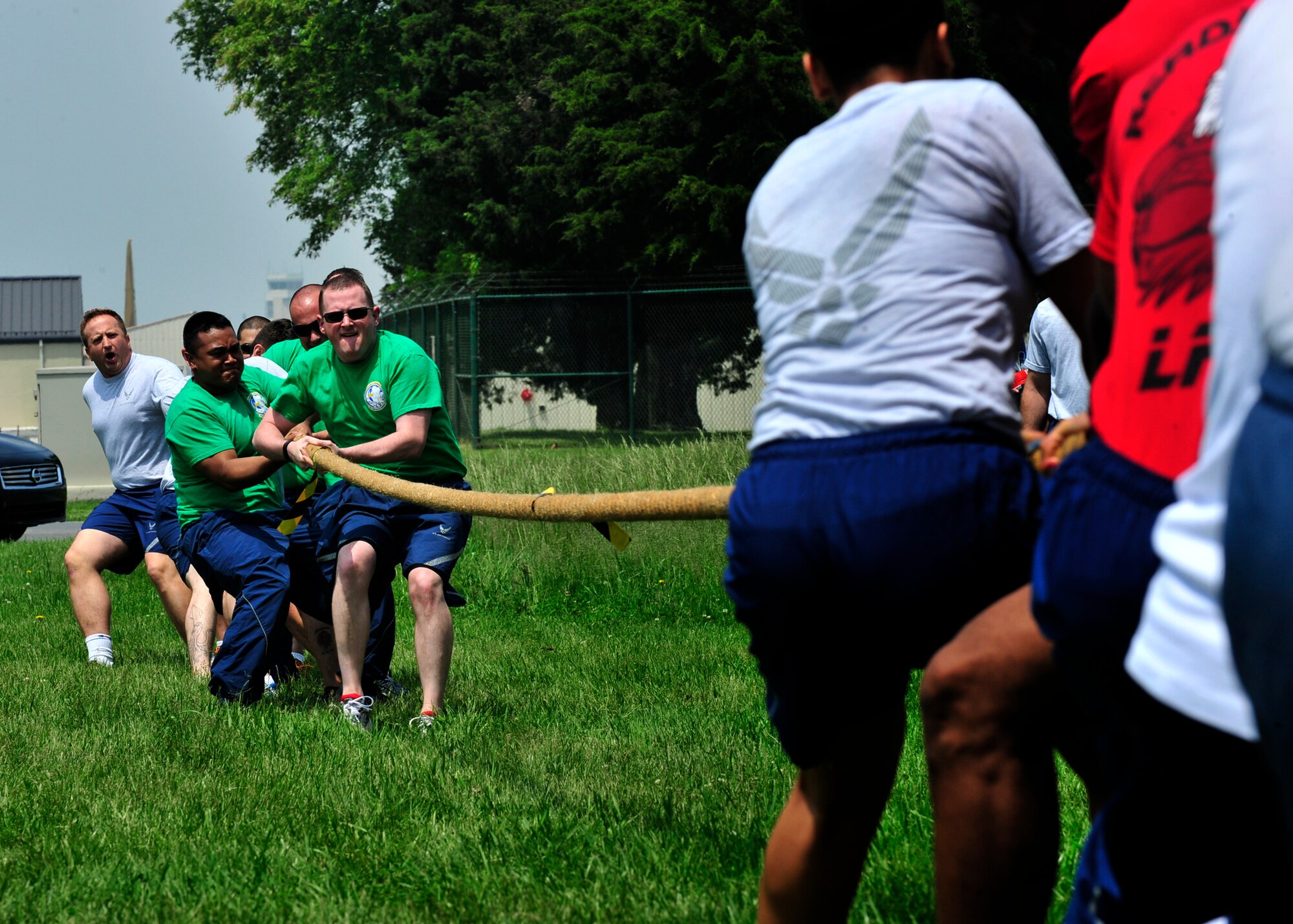Airman from the 436th Comptroller Squadron and the 436th Logistics Readiness Squadron compete in the tug-o-war competition during Wingman Day May 22, 2014, at the Eagles Nest Park on Dover Air Force Base, Del.Tug-o-war was limited to ten people per team and it was a single elimination tournament. (U.S. Air Force photo/Staff Sgt. Elizabeth Morris)