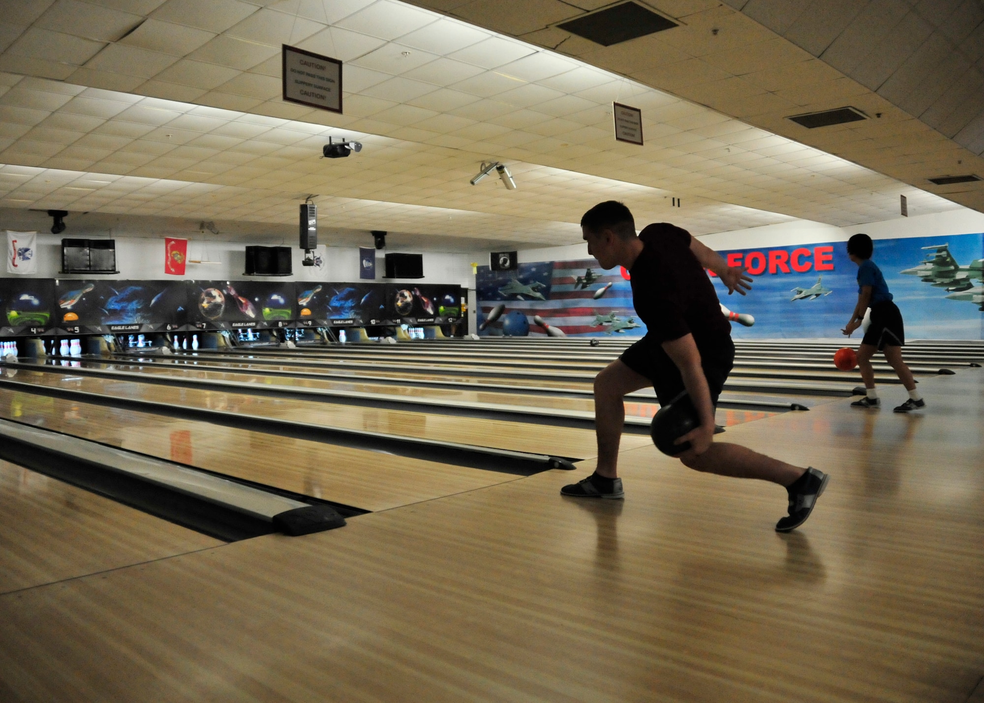 Team Dover Airmen bowl during Wingman Day May 22, 2014, at the Eagle Lanes Bowling Center on Dover Air Force Base, Del. Participants were not charged for the games, but had to pay a shoe rental fee if they elected to rent shoes. (U.S. Air Force photo/Staff Sgt. Elizabeth Morris)