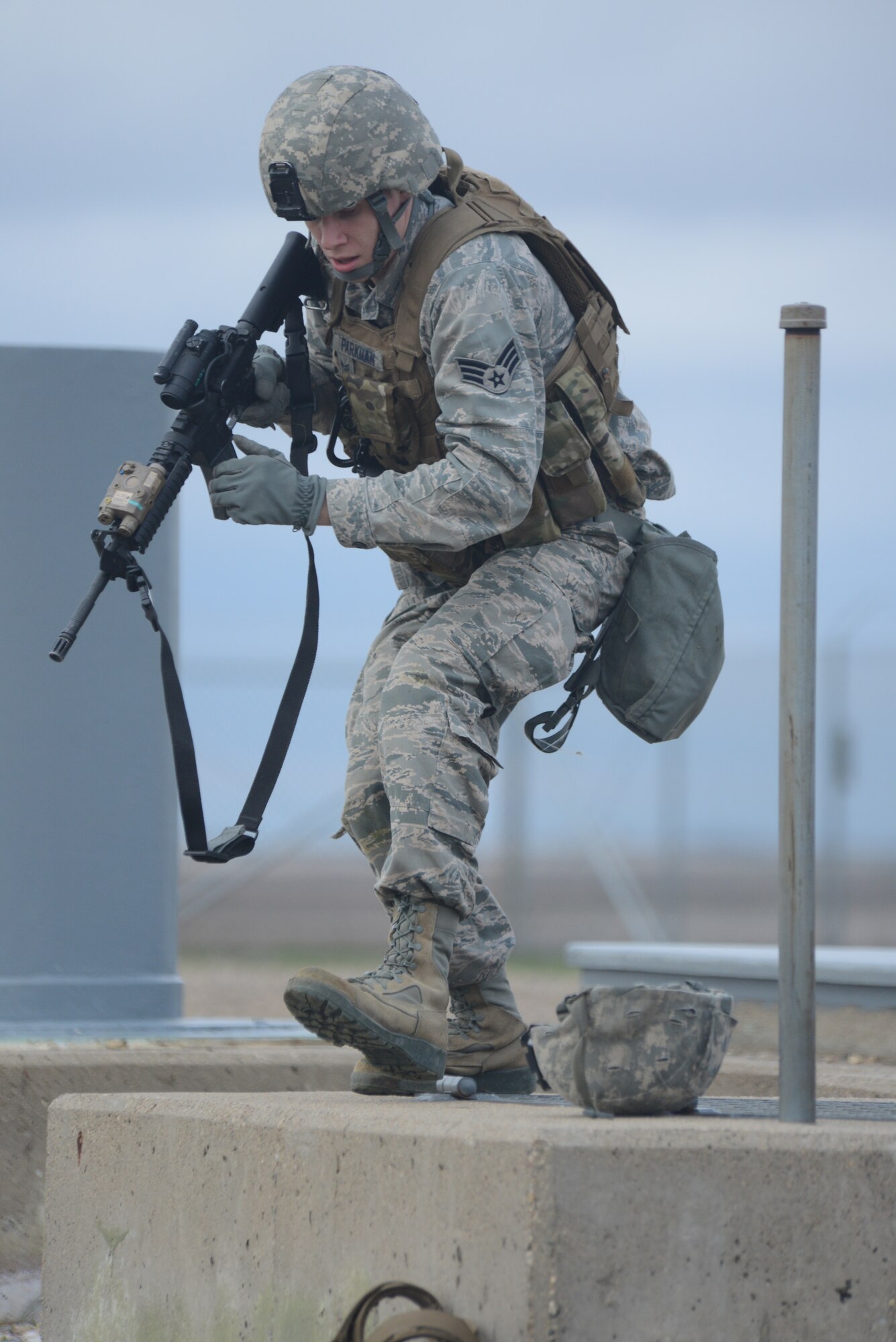Senior Airman Zachary Parkman, of the 219th Security Forces Squadron, looks for anything suspicious during an exercise at a Minot Air Force Base, N.D., missile launch facility May 20, 2014. Parkman is one of several North Dakota Air National Guard enlisted members who are doing their annual training while performing the real-World mission of missile field security, which allows their active duty counterparts to catch up on other training and mission requirements.  (U.S. Air National Guard photo by SMSgt. David H. Lipp/Released)