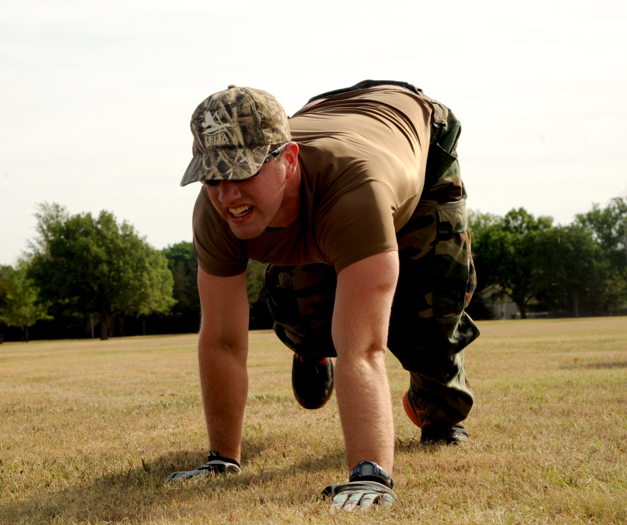 VANCE AIR FORCE BASE, Okla.-- 2nd Lt. Daniel Uptmor, with the 71st Student Squadron bear crawls for one of the events during the Defender’s Challenge May 13. For the past three years the 71st SFS has put together an obstacle course they dubbed the “Defender’s Challenge.” (U.S. Air Force photo/Senior Airman Frank Casciotta)
