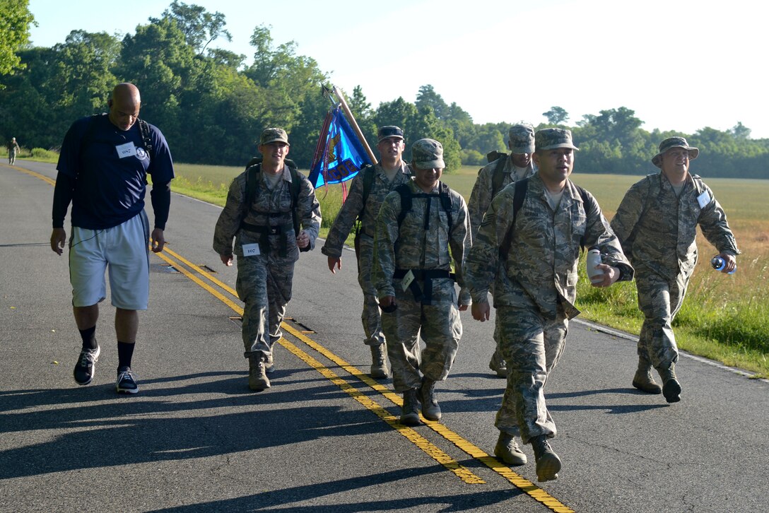 U.S. Air Force Airmen from the 735th Supply Chain Operations Group participate in the Third Annual Bataan Death March at the Dismal Swamp Trail in Chesapeake, Va., May 24, 2014. Participants marched for 16.6 miles with weighted backpacks in recognition of the veterans who endured the original march. During WWII, the Imperial Japanese Army marched approximately 76,000 prisoners of war for more than 70 miles through the jungles of the Philippines, killing anyone who fell out of ranks. (U.S. Air Force photo by Airman 1st Class Devin Scott Michaels/Released)