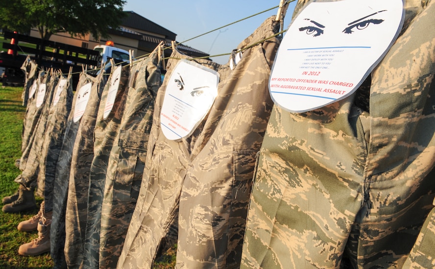 A display of uniforms hangs at the finish line of the Comprehensive Airman Fitness Day run at Moody Air Force Base, Ga., May 22, 2014. The uniforms represented all the sexual assault cases from the past two years on Moody as a visual reminder of the impact of sexual assault. (U.S. Air Force photo by Tech. Sgt. Joshua J. Garcia/Released)