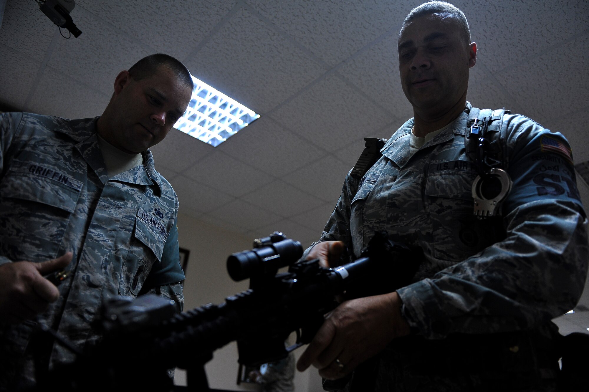 Tech. Sgt. David Gray clears his weapon inside the 380th Expeditionary Security Forces Squadron armory May 28, 2014, at an undisclosed location in Southwest Asia. Gray is deployed from the 113th Security Forces Squadron, District of Columbia Air National Guard. (U.S. Air Force photo byTech. Sgt. Russ Scalf/Released)