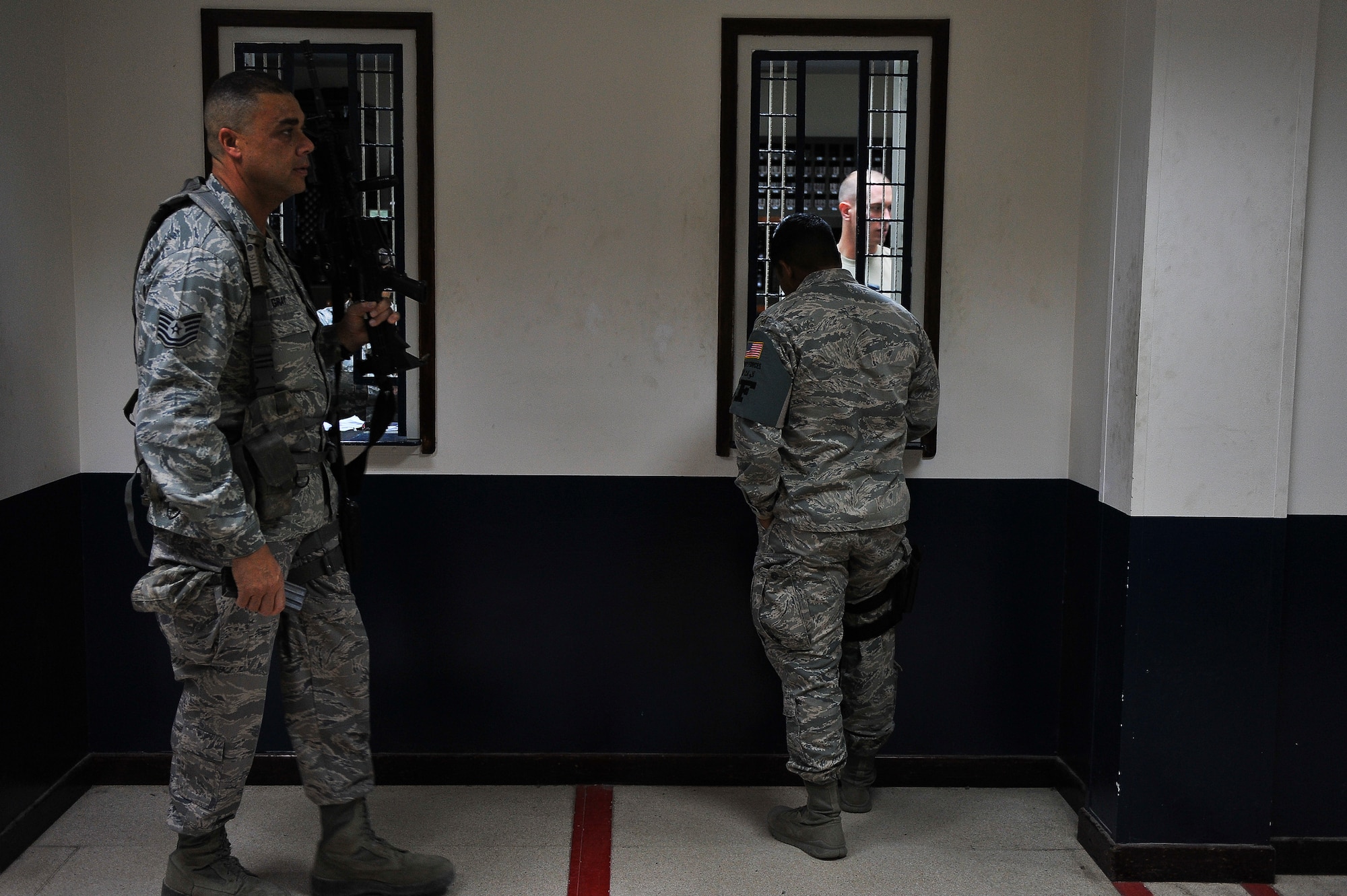 Tech. Sgt. David Gray receives his weapon from 380th Expeditionary Security Forces Squadron armory personnel May 28, 2014, at an undisclosed location in Southwest Asia. Gray has overcome battles with depression and rejects the notion that seeking help will have a negative impact on military careers.  (U.S. Air Force photo byTech. Sgt. Russ Scalf/Released)