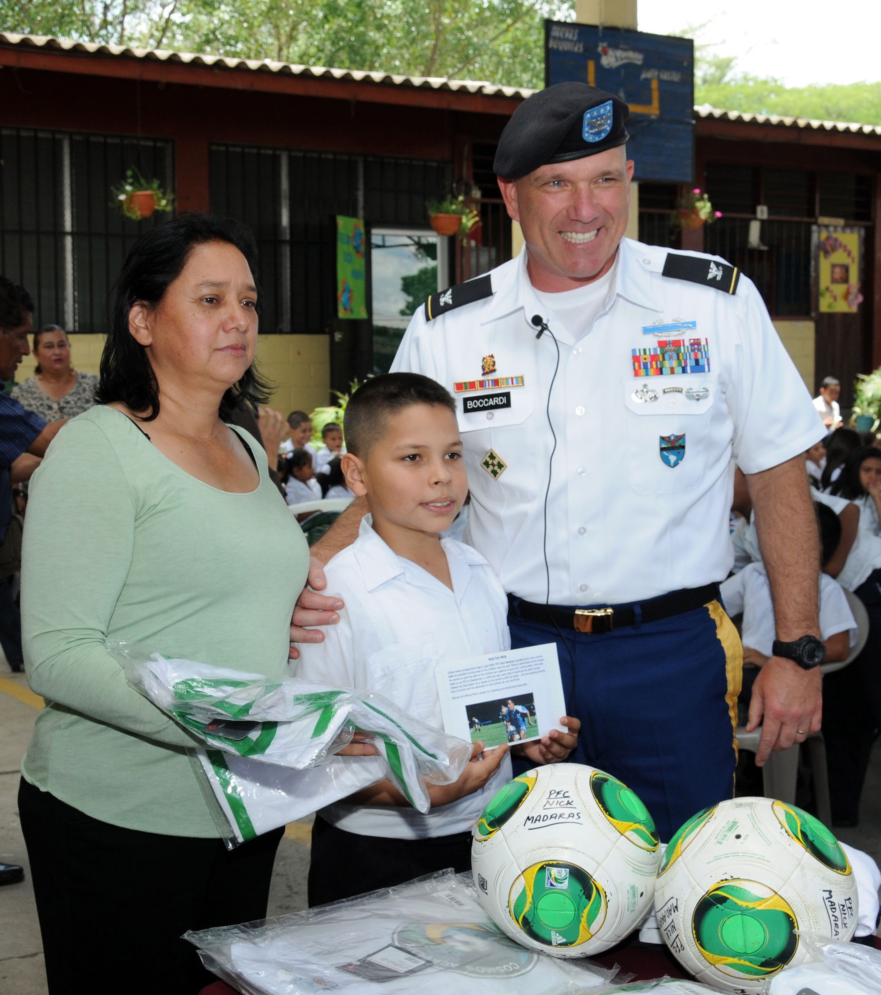 U. S. Army Col. Thomas Boccardi, Joint Task Force-Bravo commander, presents soccer balls and uniforms donated by the Kick For Nick Foundation to Escuela Francia.  Joint Task Force-Bravo, non-government organizations Clean the World, Bridge Ministries and Kick for Nick Foundation, the Honduran 21st Military Police Battalion and the Honduran National Police formed a partnership to distribute soap kits, backpacks with school supplies, tooth brushes and tooth paste, soccer balls and uniforms to students at eight Tegucigalpa, Honduras schools in a two-day event, May 20-21, 2014.  The group handed out over 4,200 soap kits, 600 backpacks, 150 tooth brushes and tooth paste, and 50 soccer balls.  (Photo by U. S. Air National Guard Capt. Steven Stubbs)